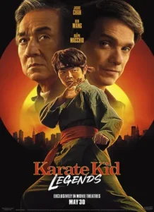Home 32 "Poster for 'Karate Kid Legends' featuring a martial artist in a traditional karate stance, wearing a red belt, with a city skyline and a large red circle in the background."